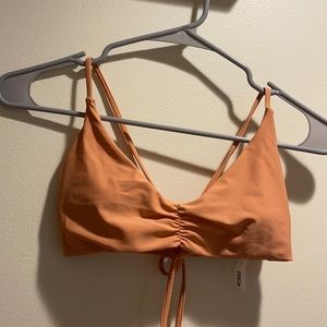 Nude to tan swim top